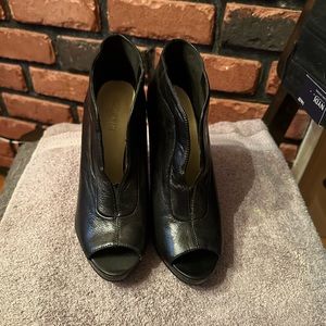 Nine West peep toe black leather bootie heels.
